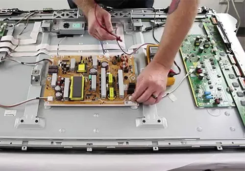 Samsung TV technician repairing TV